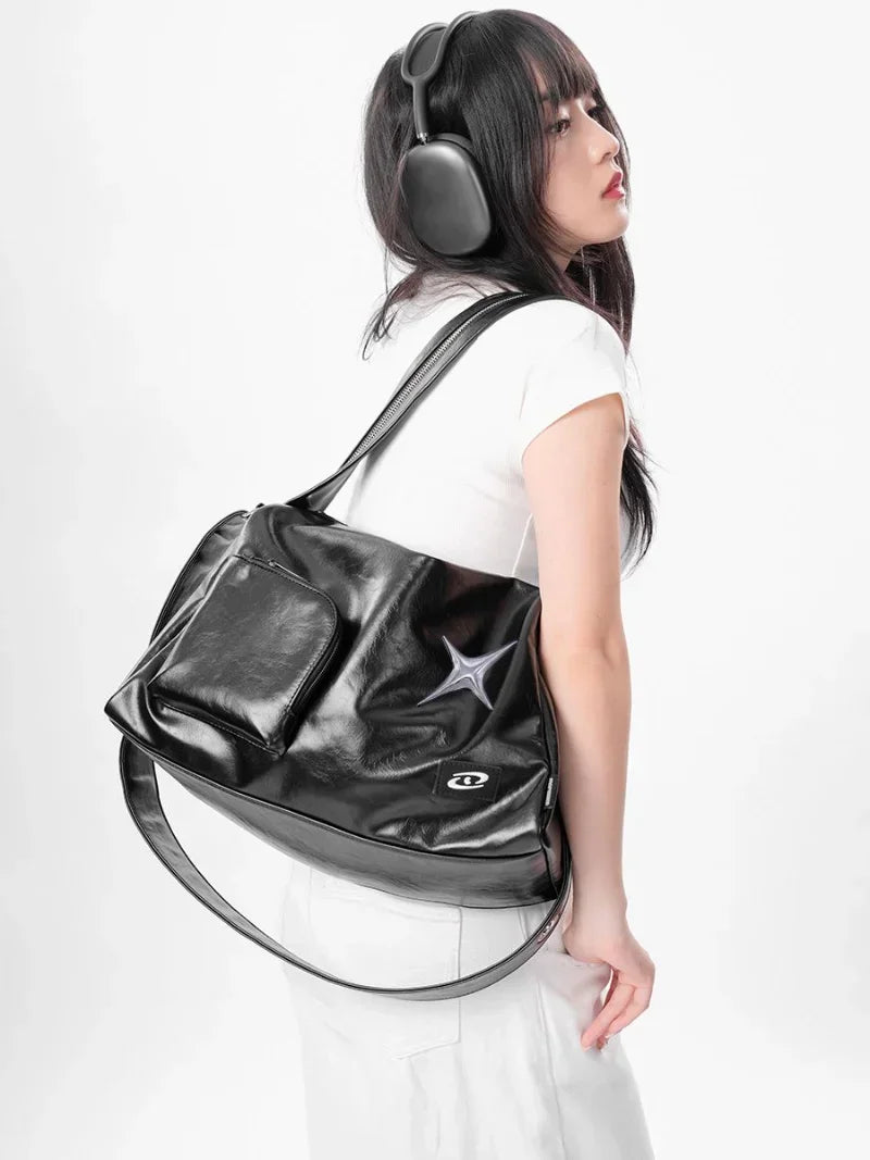 Model wearing the black Star Design Shoulder Bag