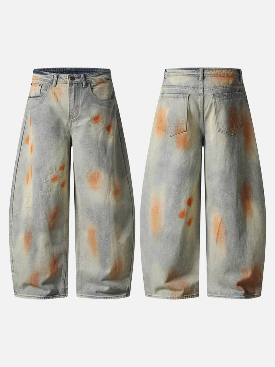 Distressed paint-splatter wide-leg denim jeans