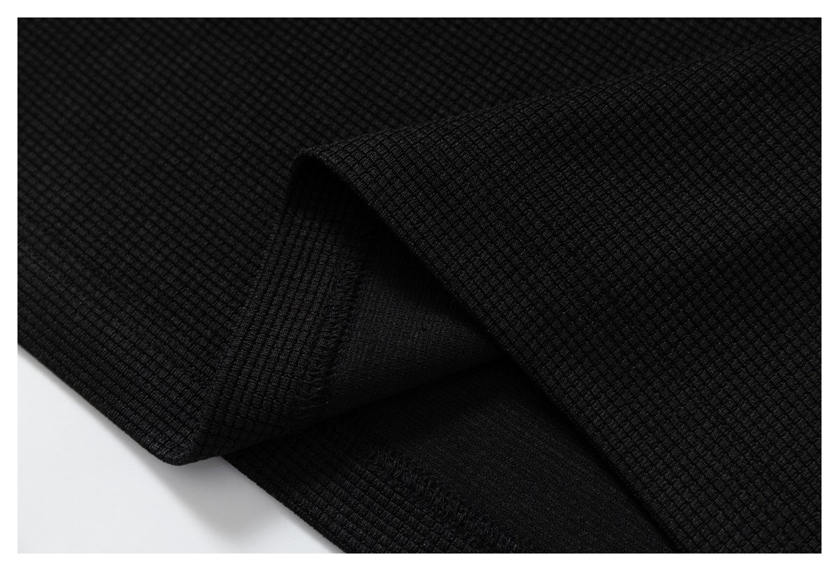 DAXUEN black polo shirt with leopard print collar and cross graphic