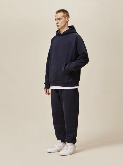 A guy wearing royal blue Explorer Tracksuit side view
