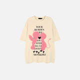 front view of the beige Devil & Angel Loose T-shirt in a gray background