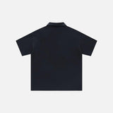 Back view of the black Retro Zip-up Polo Patchwork T-shirt in a gray background from DAXUEN