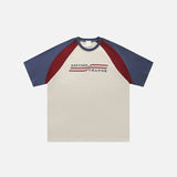 Front view of the beige Y2K Letter Striped Print T-shirt in a gray background from DAXUEN.