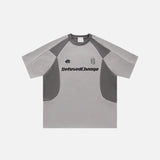 Front view of the gray Retro Racing Patchwork T-shirt in a gray background from DAXUEN.