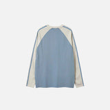 Back view of the blue Alternative Vibes Long Sleeve T-shirt in a gray background