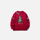 Front view of the red Fringe Forest Sweater in a gray background