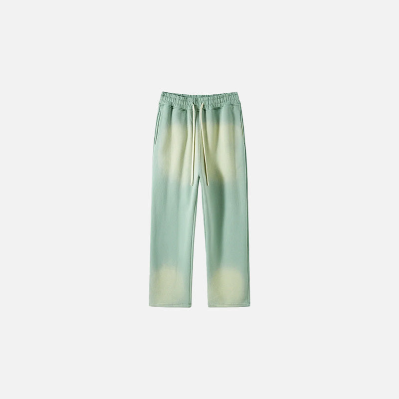Front view of the light green Casual Noir Relax Pants in a gray background