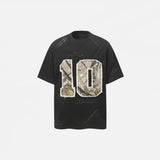 Front view of the black Vintage Grunge Patch T-Shirt in a gray background
