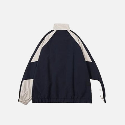 back view of the beige color of the Windbreaker Women's Jacket in a gray background