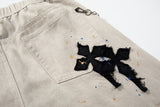 Gothic Cross Embroidered Distressed Denim Jeans