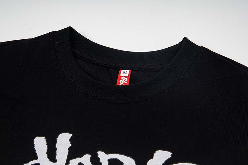 DAXUEN Black layered t-shirt with cartoon graphic