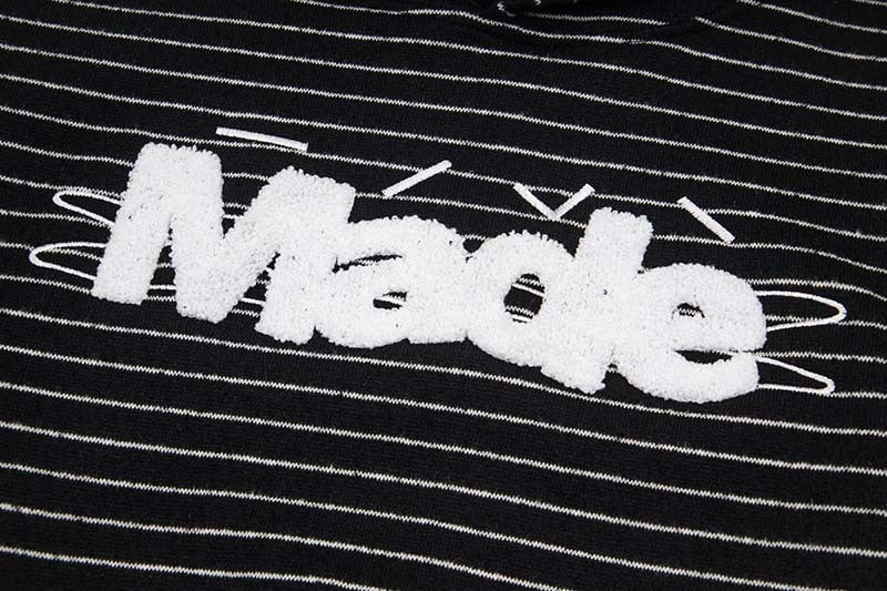 DAXUEN Oversized striped hoodie with 'Made' text