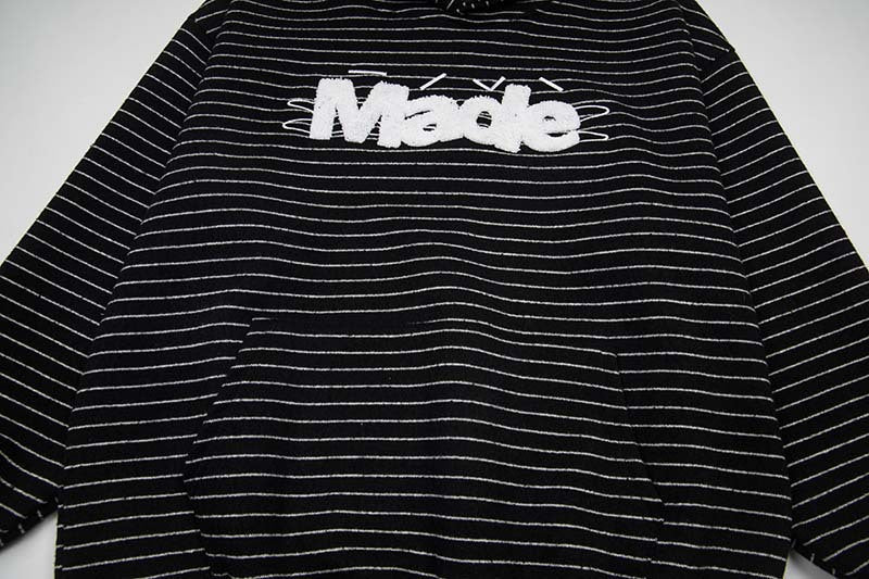 DAXUEN Oversized striped hoodie with 'Made' text