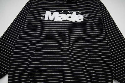 DAXUEN Oversized striped hoodie with 'Made' text