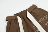 DAXUEN Graphic wide-leg trousers in black and mocha