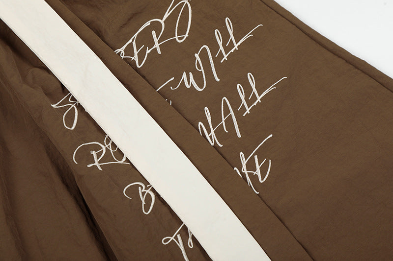 DAXUEN Graphic wide-leg trousers in black and mocha