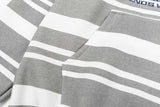 DAXUEN Distressed text oversized hoodie with stripes