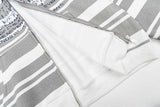 DAXUEN Distressed text oversized hoodie with stripes