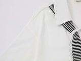 Short-sleeved collared shirt with star appliqués
