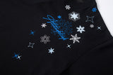 Oversized T-shirt with snowflake and star graphics