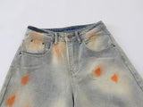 Distressed paint-splatter wide-leg denim jeans
