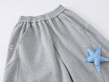 Loose-fitting wide leg sweatpants with star appliqué