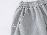 Loose-fitting wide leg sweatpants with star appliqué