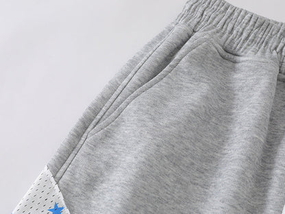 Grey wide-leg sweatpants with patchwork designs