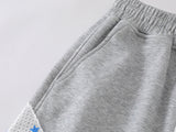 Grey wide-leg sweatpants with patchwork designs