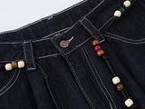 High-waisted wide-leg denim pants with bead details