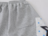 Grey wide-leg sweatpants with patchwork designs