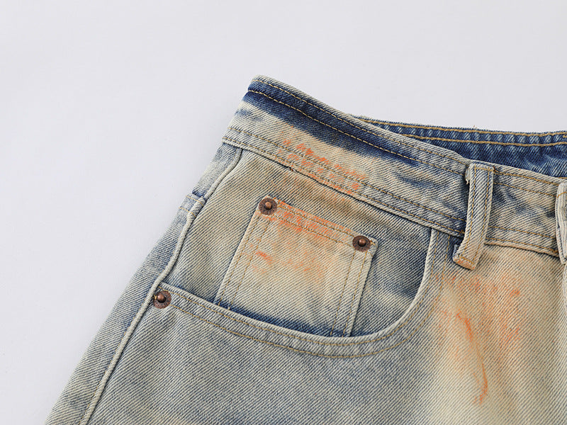 Distressed paint-splatter wide-leg denim jeans