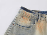 Distressed paint-splatter wide-leg denim jeans