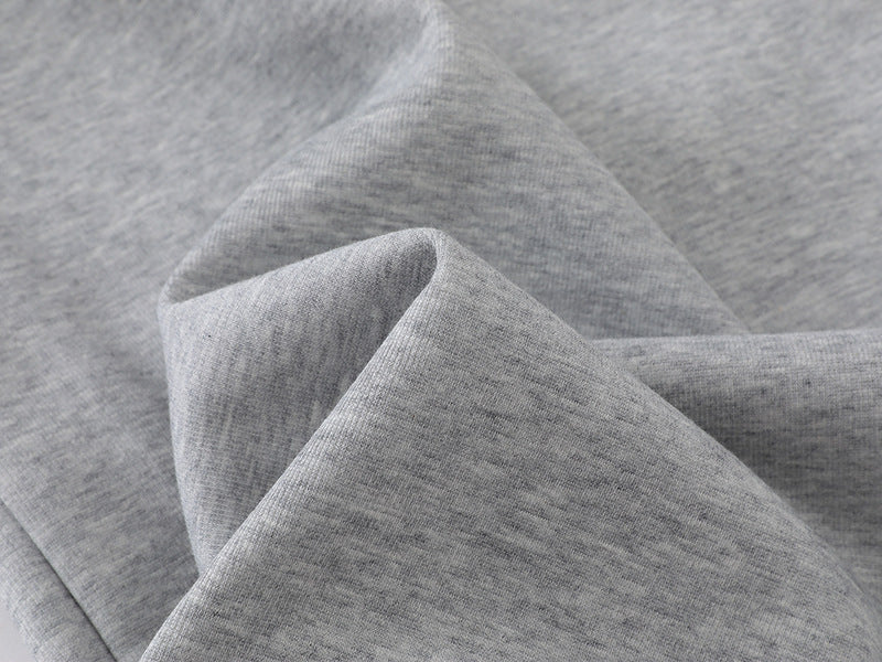 Grey wide-leg sweatpants with patchwork designs