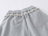 Loose-fitting balloon pants with plaid details