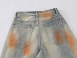Distressed paint-splatter wide-leg denim jeans