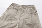 Deconstructed wide-leg cargo pants in light beige