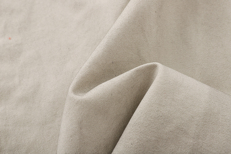 Deconstructed wide-leg cargo pants in light beige