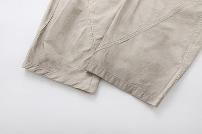 Deconstructed wide-leg cargo pants in light beige