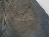 Wide-leg distressed denim jeans