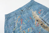 Light blue wide-leg denim culottes with abstract patterns