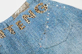 Light blue wide-leg denim culottes with abstract patterns