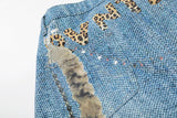 Light blue wide-leg denim culottes with abstract patterns