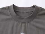DAXUEN Distressed graphic T-shirt with human silhouette