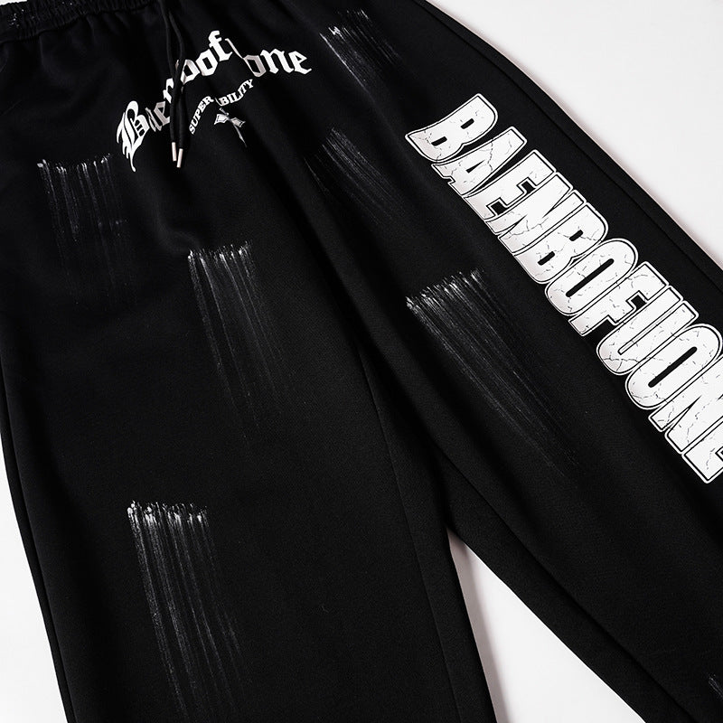 DAXUEN Distressed graffiti wide-leg sweatpants