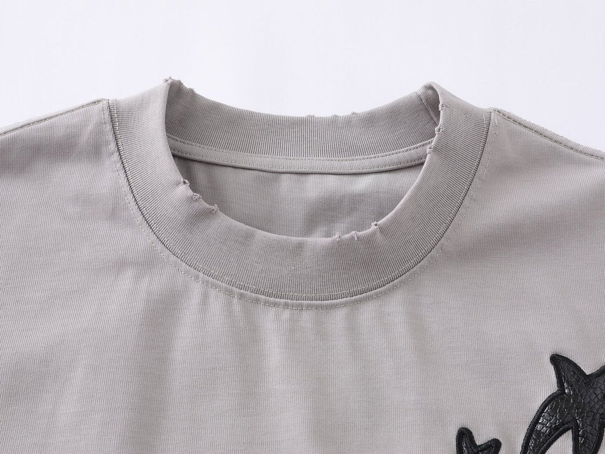 DAXUEN Distressed oversized t-shirt with star graphics