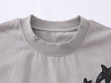 DAXUEN Distressed oversized t-shirt with star graphics