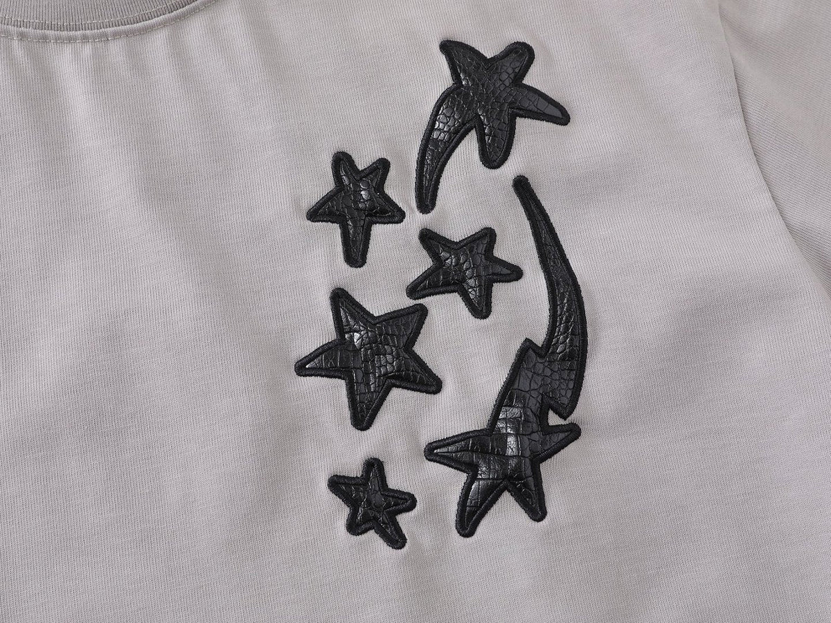 DAXUEN Distressed oversized t-shirt with star graphics