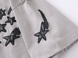 DAXUEN Distressed oversized t-shirt with star graphics