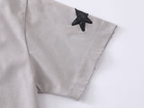 DAXUEN Distressed oversized t-shirt with star graphics